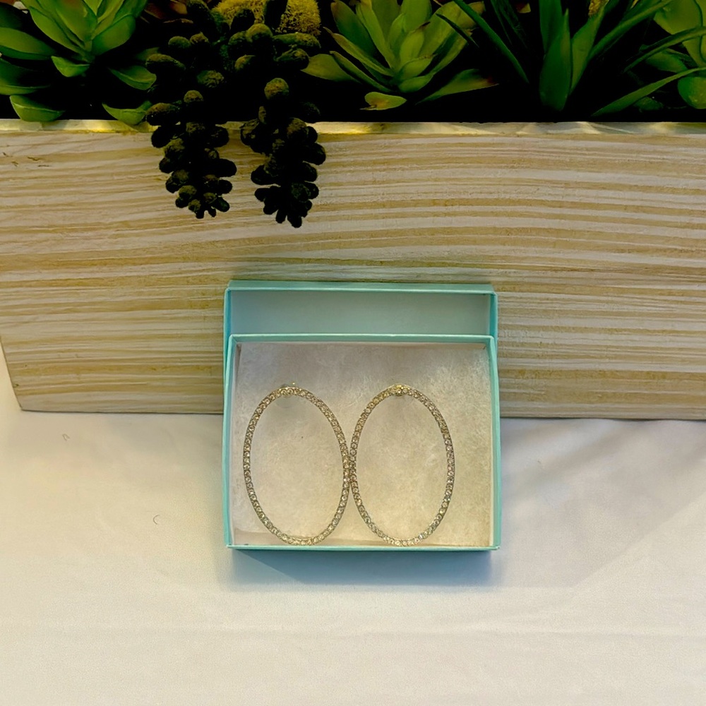 Micro crystals accentuate these wardrobe essential earrings.